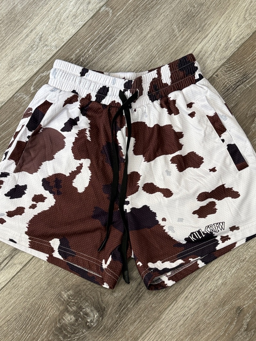 KILL CREW Cow Print Athletic Shorts in cow print